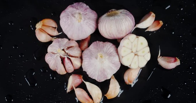 Head, cloves and sliced garlic.