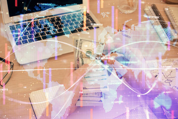 Multi exposure of financial theme drawing hologram and USA dollars bills and man hands. Business concept.