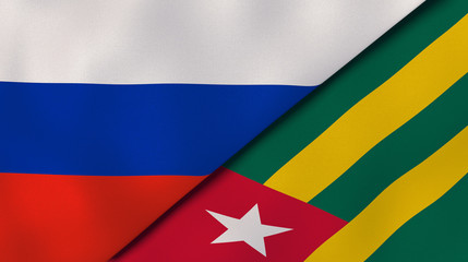 The flags of Russia and Togo. News, reportage, business background. 3d illustration