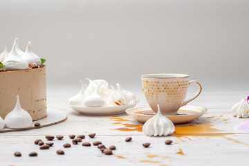 Spilled coffee on the table with cake