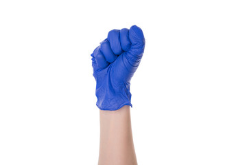 Photo of raised up clenched fist in protective latex glove isolated over white cutout color background