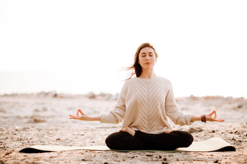 Fototapeta na wymiar yoga meditation sunset nature girl woman calm asana sea