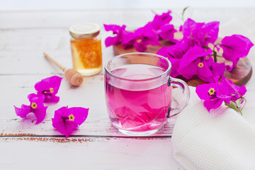 tea of Bougainvillea flowers or te bugambilia with honey and raw flowers and leaves