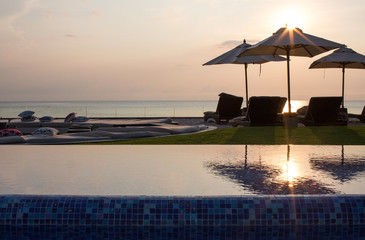Hua Hin Prachuap Khiri Khan Thailand    9 30 2019 Table lying in the middle of the beach, pool and sea with sunset
