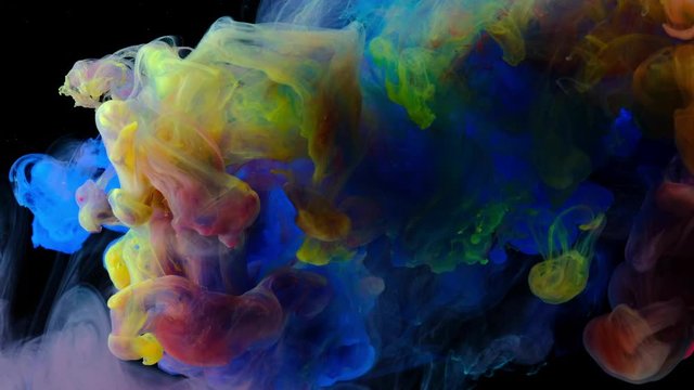 Color paint drops in water , abstract color mix , drop of Ink color mix paint falling on water Colorful ink in water, 4K footage,
