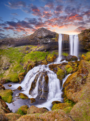 Sheep's Waterfall. Famous tourist landscape. Travel concept background. Dramatic summer sunrise, Iceland, Atlantic Ocean, Europe. Travel postcard. Incredible sunrise. Amazing landscape