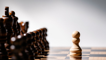 Team. White Chess Pawns on chess board in black and white. Leader.
