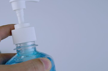 Plastic bottle pump with alcohol hand gel. Hand Sanitizer Antibacterial Cleansing Gel Alcohol Rub...