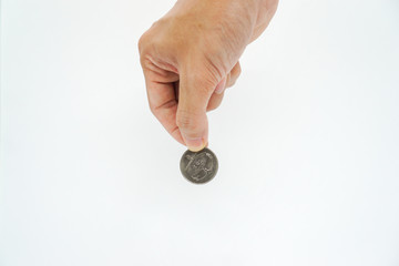 hand holding a coin