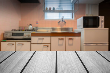 Fototapeta na wymiar White wooden table in a small kitchen