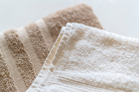 Close - up White and brown towels are neatly folded