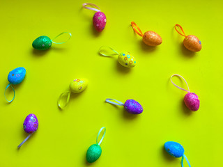 Colorfull eggs on color background symbolize joy and hippieness of great Easter Holiday.