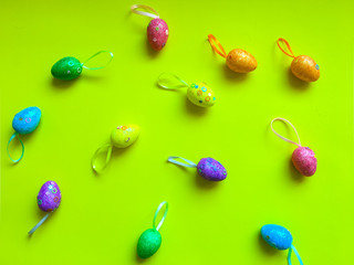 Colorfull eggs on color background symbolize joy and hippieness of great Easter Holiday.