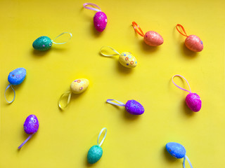 Colorfull eggs on color background symbolize joy and hippieness of great Easter Holiday.