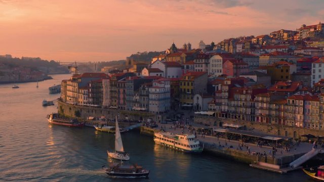 Porto, Portugal. Aerial view of the old city with promenade of the Douro river at sunset