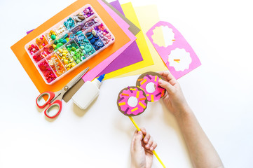 Donuts made of paper. Glasses craft creative.