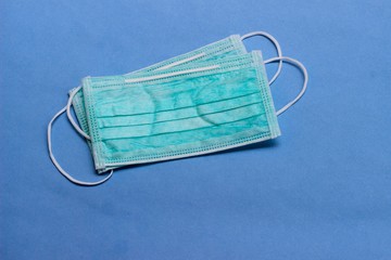 Photo, Light Green Surgical mask at white background for prevention from covid-19 and other virus...