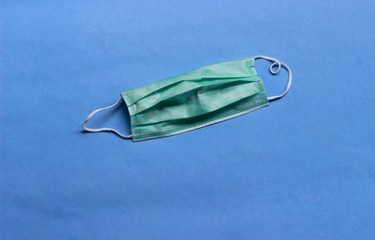 Photo, Light Green Surgical mask at white background for prevention from covid-19 and other virus...