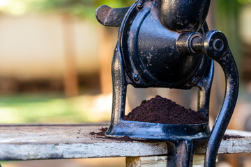 Ground coffee in the manual grinder