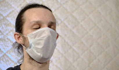a man in a medical mask on a white background coronavirus