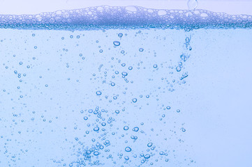 Naklejka na ściany i meble Light blue bubbles and water White background