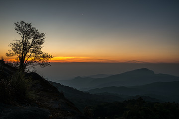 Fototapeta na wymiar Twilight and morning sun at a viewpoint in the mountains of northern Thailand on a new day