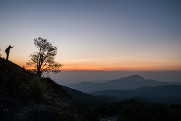 Twilight and morning sun at a viewpoint in the mountains of northern Thailand on a new day