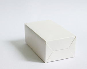 Closed white box on white background