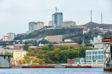 Summer, 2015 - Vladivostok, Russia - The marine facade of Vladivostok. Residential and business buildings located on the green hills of the capital of the Far East, Vladivostok