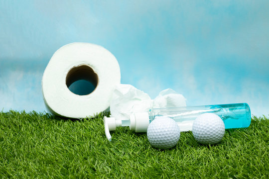 Golfer stay home with golf ball and toilet paper and hand gel stay home stay safe during corona virus