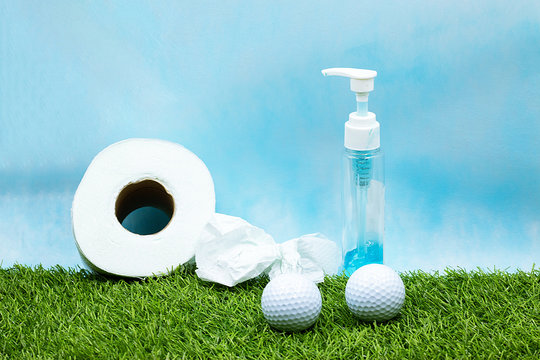 Golfer stay home with golf ball and toilet paper and hand gel stay home stay safe during corona virus