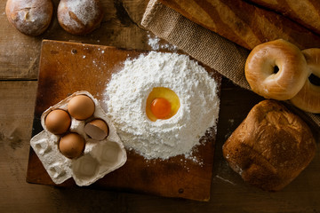 Fresh bread image.
Breads,baguettes,bagels and flour with some eggs.
