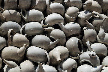 A wall of teapots. Ceramic walls.