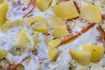 A plate of steamed potatos with egg
