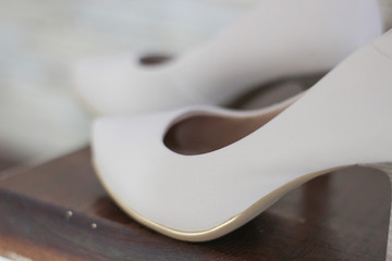 Wedding concept. Bride's white shoe.