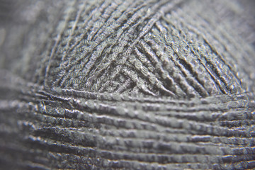Pattern of thick black knitting threads in the ball
