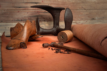 Vintage old cobblers tools and leather