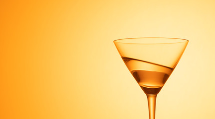 Martini glass on color background