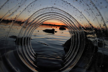 Sunset through water bottle