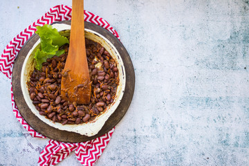 Mexican hot spicy beans in frying pan. Vegan food.