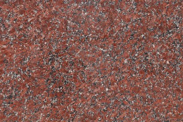 Marble terracotta surface with white and black splashes.