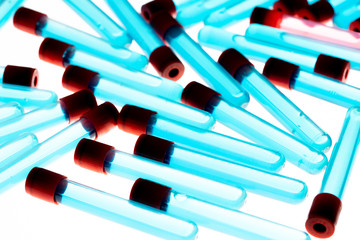 Colored test tubes on white background . Flat lay. Flatly.