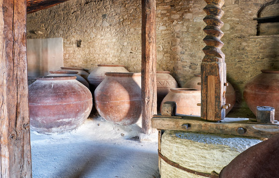 Old wine press in the Commandaria Storage Museum in Laneia village. Mount Troodos. Cyprus