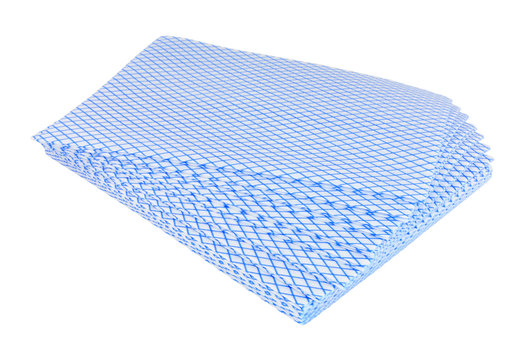 Pile of blue disposable multi purpose viscose cleaning cloths isolated on a white background