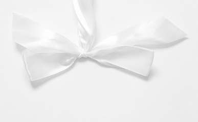White bow on white background