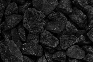 Natural black coals for background design. Industrial coals. Volcanic rock energy on earth.