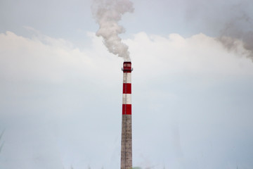 Air pollution: industrial chimneys, industrial smokestack release toxic fumes to the environment