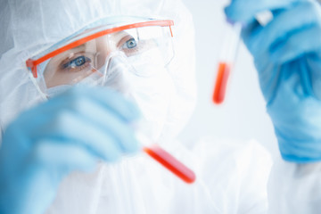 Analysis virus in China and world from coronavirus, doctor in protective chemical suit with...