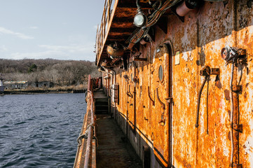 the deck of a very old abandoned completely rusty ship