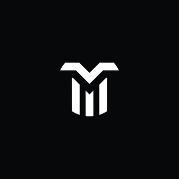 Minimal elegant monogram art logo. Outstanding professional trendy awesome artistic TM MT initial based Alphabet icon logo. Premium Business logo White color on black background